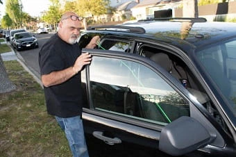 Close-up of a Locksmith Las Vegas car's driver-side mirror and window.