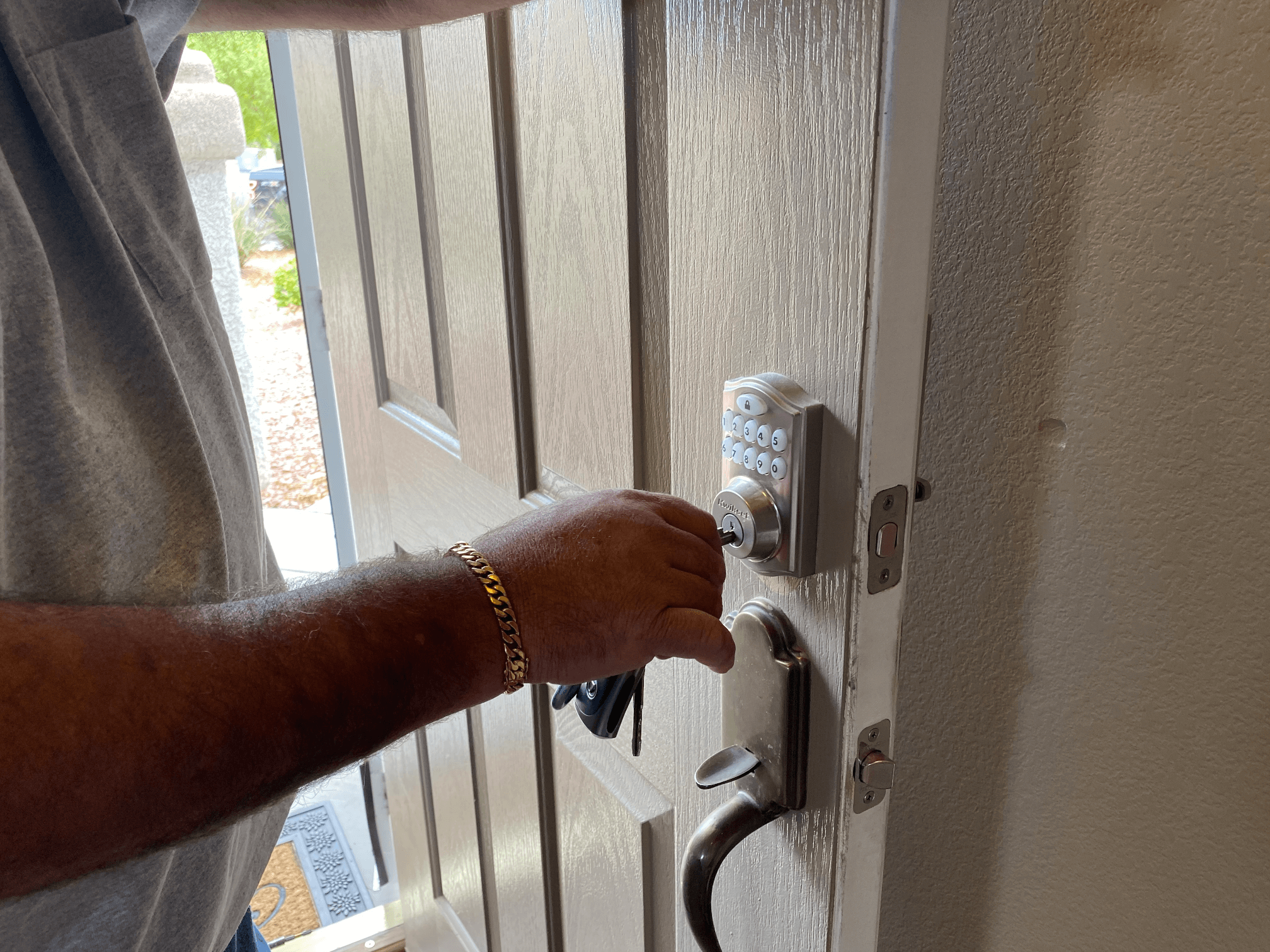 Old man working on a door lock